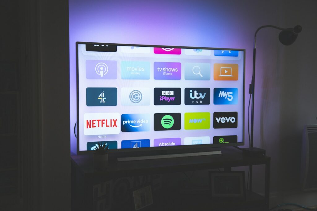Television screen displaying streaming service app icons; illustrative photograph