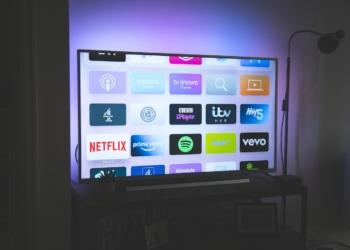 Television screen displaying streaming service app icons; illustrative photograph