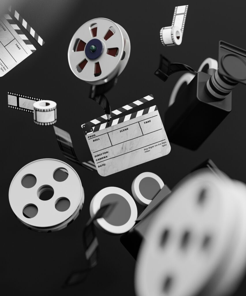 Three-dimensional illustration of a film reel, camera and clapperboard