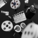 Three-dimensional illustration of a film reel, camera and clapperboard